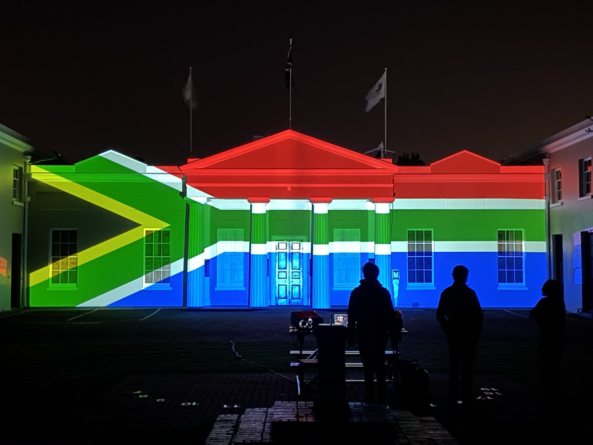 Main Building of the SAAO with the South African flag projected onto it